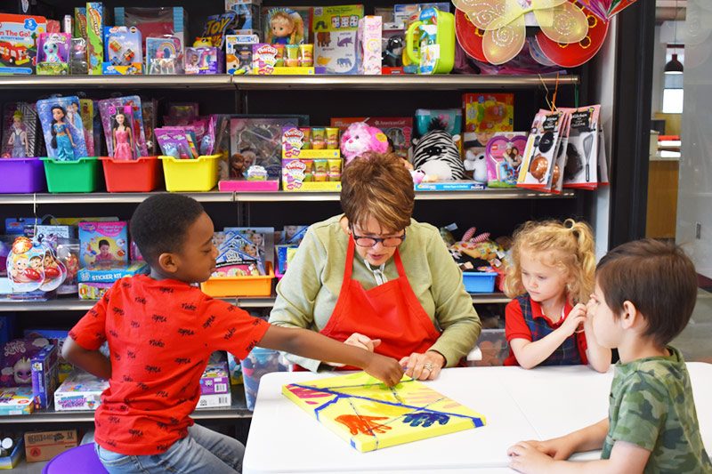 Children complete an art project