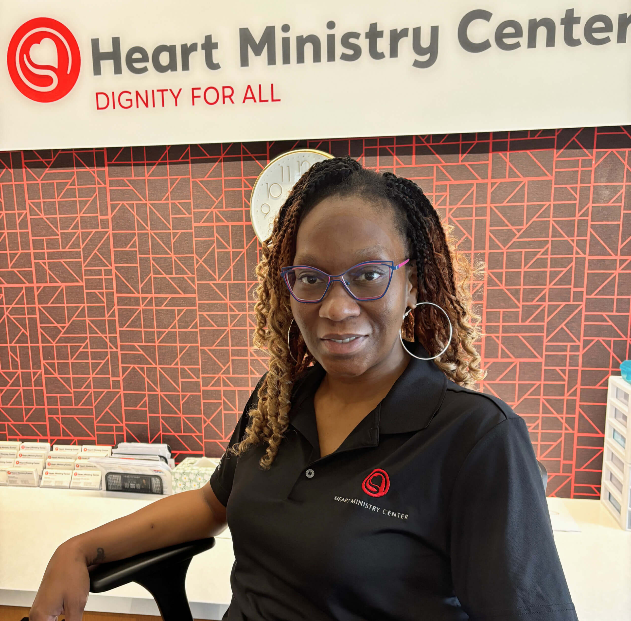 Jacqueline Dumas, volunteer coordinator, sits in the lobby welcoming volunteers